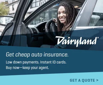 Woman in car, considering Dairyland auto insurance